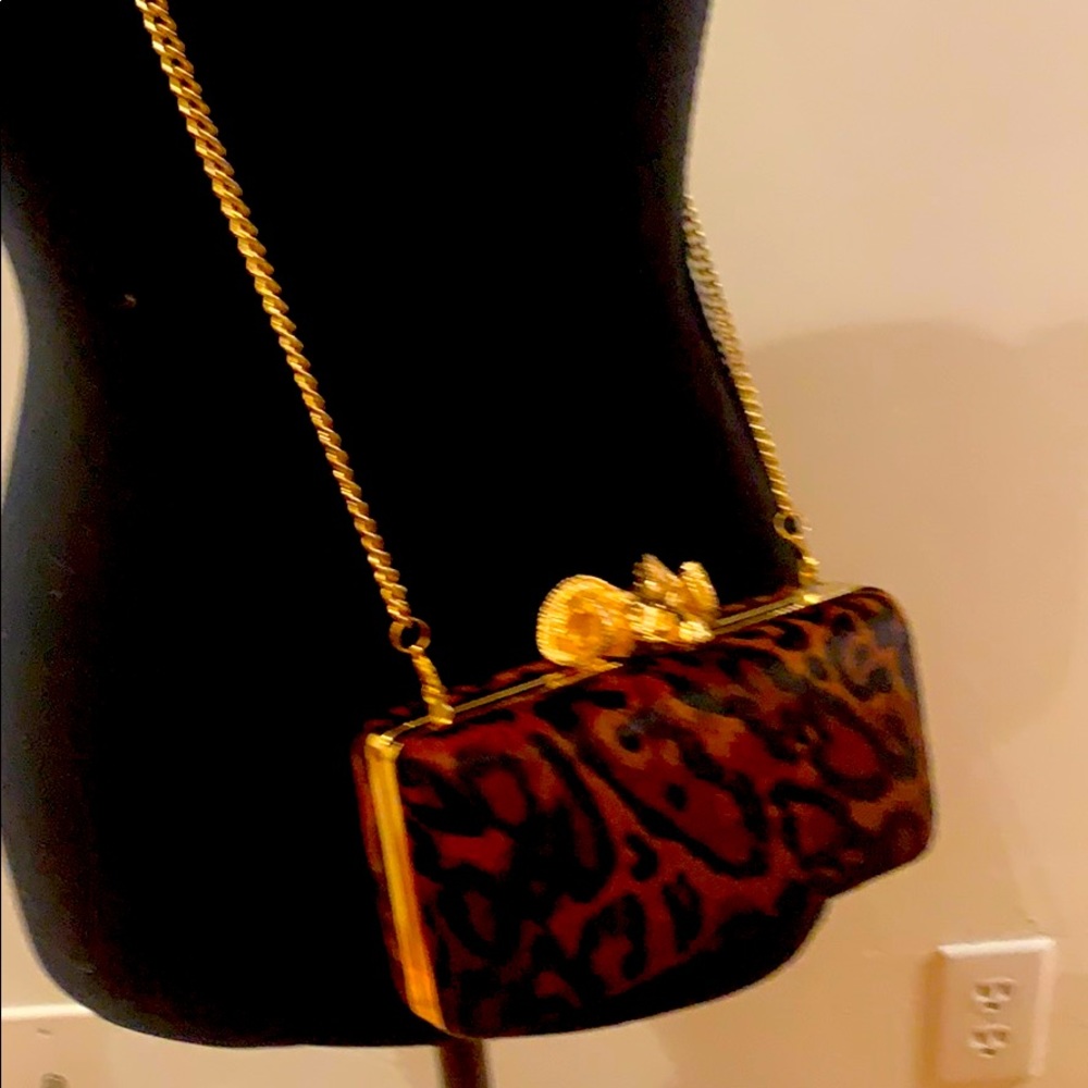 Leopard clutch with gold chain strap